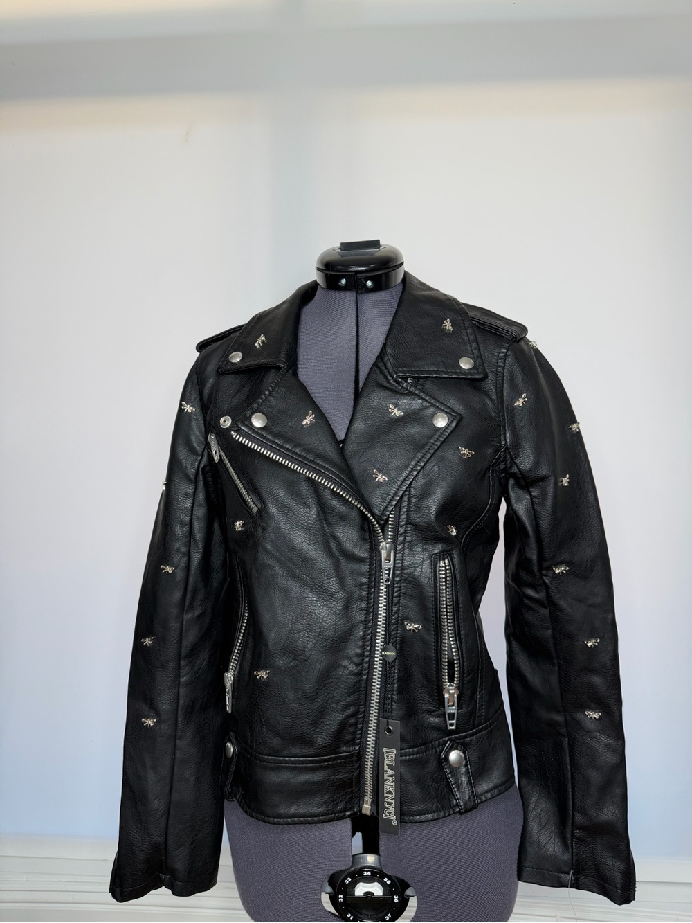 Blank NYC Black Faux Leather Biker Jacket with Dragonfly Embellishments